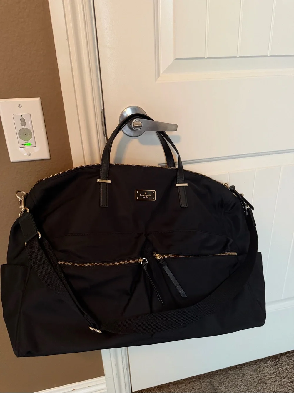 kate spade black nylon duffel with gold hardware